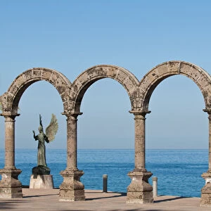 Mexico, Puerto Vallarta. Los Arcos and Angel of Hope and Messenger of Peace sculpture