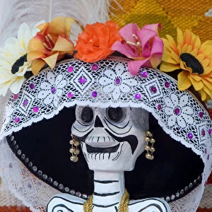 Mexico, San Miguel de Allende, Skeleton with hat on Day of The Dead festival. Credit as