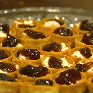 Mini bouchees canapees croustades filo tartlets filled with French goat cheese chevre