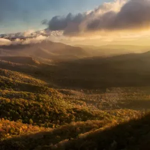 Misty autumn sunrise and Blue Ridge Mountains from Blue Ridge Parkway from Pounding