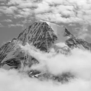 Monch (4, 107 m) rising above clouds, Bernese Alps, Switzerland Monch (4, 107 m) rising above clouds, Bernese Alps, Switzerland