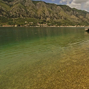 Montenegro, Kotor, transparent green water of the Adriatic sea at the foot of a fjord s