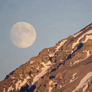 full moon over Gates of the Arctic National Park, North Slope of the Brooks Range, Alaska