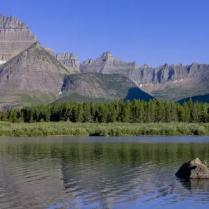 Mountains reflected in Lake. Glacier National Park. Montana. USA