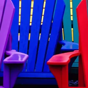 N. A. Canada, Nova Scotia, Bridgewater. Colorful adirondack chairs N. A. Canada, Nova Scotia, Bridgewater. Colorful adirondack chairs
