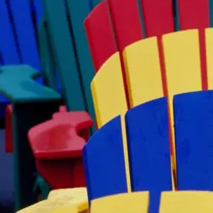 N. A. Canada, Nova Scotia, Bridgewater. Colorful adirondack chairs N. A. Canada, Nova Scotia, Bridgewater. Colorful adirondack chairs