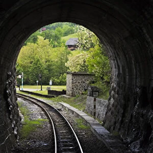 Narrow-gauge heritage railway track for the Sargan Eight train running through a tunnel