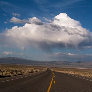 NEVADA. USA. Cumulus clouds over US Highway 50. The Loneliest Road in America"