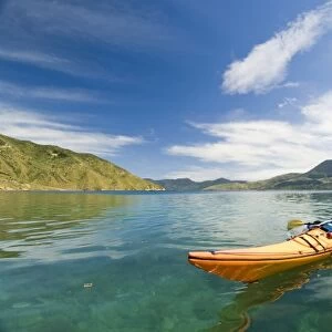 New Zealand, South Island, Marlborough Sounds. Sam Robinson sea kayaking. (MR)