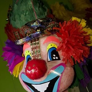 Nicaragua, Granada. Clown pinata on display in shop