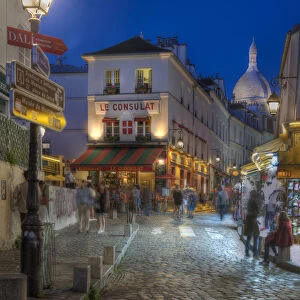 Night street scene in Montmartre district in Paris, France