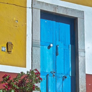 North America, Mexico, Guanajuato The colorful homes and buidings, blue front door