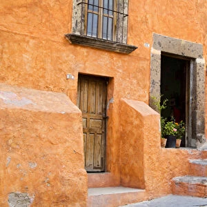 North America, Mexico, Guanajuato state, San Miguel. An orange colored stucco house