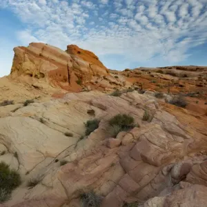 North America, USA, Nevada. Colored and striated rock formations and clouds North America, USA, Nevada. Colored and striated rock formations and clouds