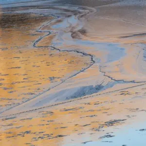 North America, USA, Utah. Ice patterns, canyon wall reflections on the Colorado River