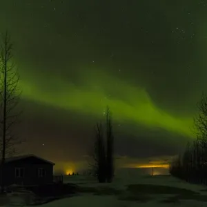 Northern Lights or aurora borealis over Laugardalur during winter in Iceland. europe