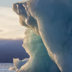 Norway, Svalbard, Kvitoya. Iceberg and fog bank at sunrise Norway, Svalbard, Kvitoya. Iceberg and fog bank at sunrise