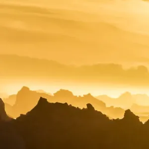 Norway, Svalbard, Nordaustlandet. Silhouette of icebergs backlit at sunset. Credit as Norway, Svalbard, Nordaustlandet. Silhouette of icebergs backlit at sunset. Credit as