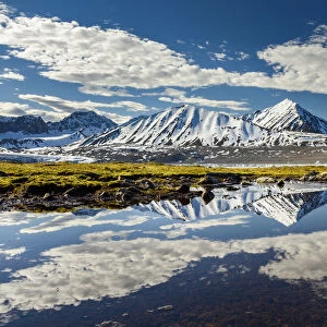 Norway, Svalbard, Spitsbergen. 14th July Glacier, mountain and cloud reflections