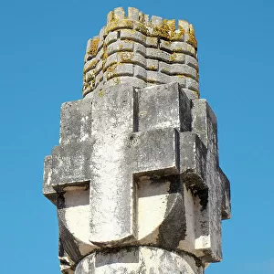 Obidos, Portugal. Old cross on pillar