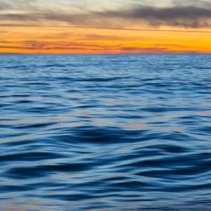Ocean waves at sunset, Greenland Ocean waves at sunset, Greenland