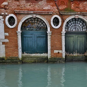 Old and colorful doorways and windows in Venice Italy