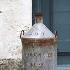An old tin jar for transporting olive oil Crousnillon Huiles. Moulin Mas des Barres olive mill