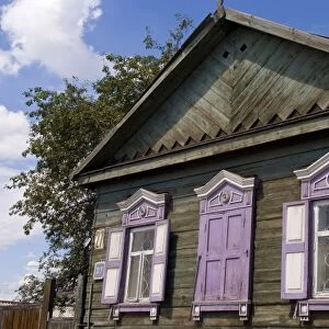 Old wooden worn house with colorful shutters in Irkutsk in Siberia Russia