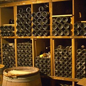 Older vintages of wine aging in the cellar. Alain Voge, Cornas, Ardeche, Ardeche