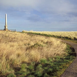 A paved trail leads to the memorial shaft / obelisk on memorial hill at Whitman Mission