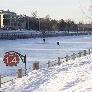 People skating on the frozen canal in winter, Ottawa, Ontario, Canada