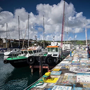 Portugal, Azores, Faial Island. Horta Marina with paintings by yacht crews on its piers
