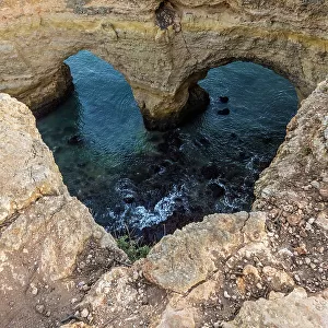Portugal. Heart-shaped rock design on shore