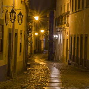 Portugal, Obidos. Walkway along the walled town of Obidos at night