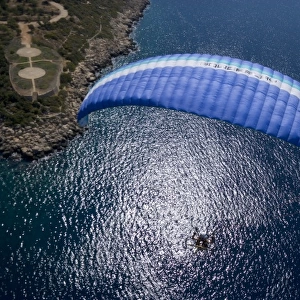 Powered paraglider flying over Kas, aerial view, Antalya, Turkey