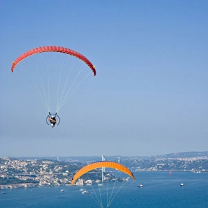 Two powered paragliders flying over Uskudar, aerial view, Bosphorus and the European