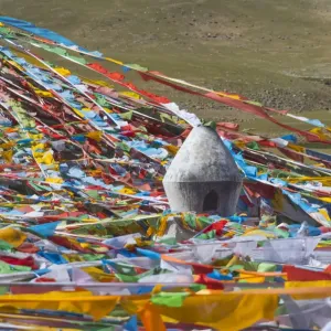 Prayer flags with juniper incense burner on Tibetan Plateau, Namtso (Lake Nam), Tibet