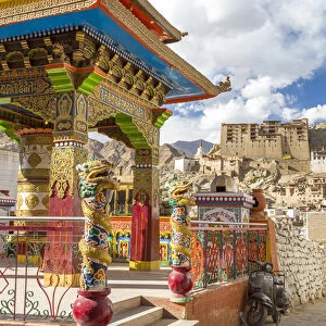 Prayer wheel & Leh Palace in background, Leh, Ladakh, India