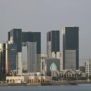 Qatar, Ad Dawhah, Doha. West Bay Development along the Corniche / Dusk