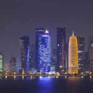 Qatar, Doha, Doha Bay, West Bay skyscrapers dawn, with World Trade Center in blue