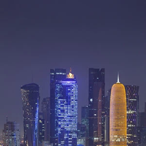 Qatar, Doha, Doha Bay, West Bay skyscrapers dawn, with World Trade Center in blue