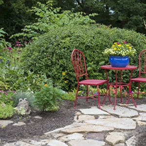 Red table & chairs with blue pot in flower garden. Marion Co. IL (PR)