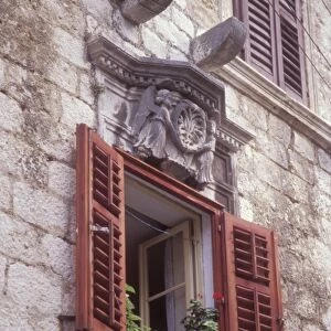 Residential window detail with ornate cornice. Hvar Town, Hvar Island. Croatia