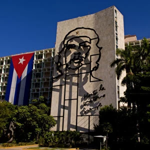 Revolution Square in Havana Cuba with large neon artwork of Che on wall and Cuban flag
