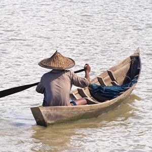 Rowing boat on the Kaladan River, between Sittwe and Mrauk-U, Rakhine State, Myanmar