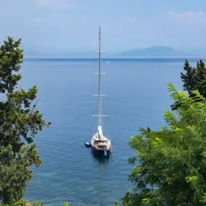 Sailboat moored in Ionian Sea, Corfu, Greece, Europe Sailboat moored in Ionian Sea, Corfu, Greece, Europe