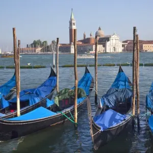 San Giorgio Maggiore Church and Bell Tower Blue Gondolas Grand Canal Venice Italy