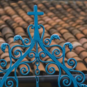 Santiago de Cuba, red tile roof and blue wrought iron cross