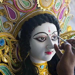 Sarasvati (Female Hindu God) idol being painted, Kolkata, West Bengal, India