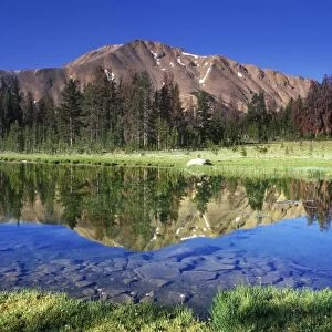 Sawtooth Mountains reflected in Fourth of July Lake, Idaho, USA